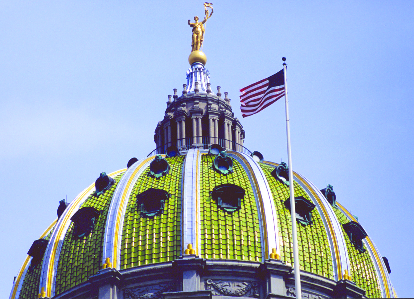 Newly-renovated Pennsylvania Capitol dome and the U.S. flag. Image from Wohlsen Construction, who performed the renovations.